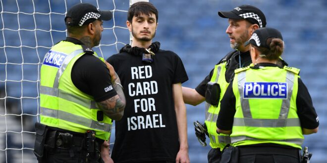 Protester in “Red Card For Israel” shirt disrupts Scotland game