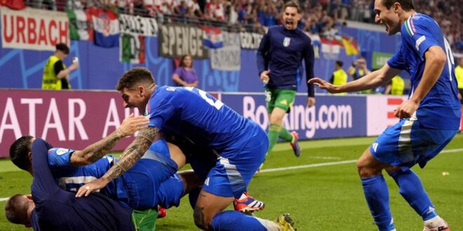 Italy wins knockout berth with 1-1 draw over Croatia