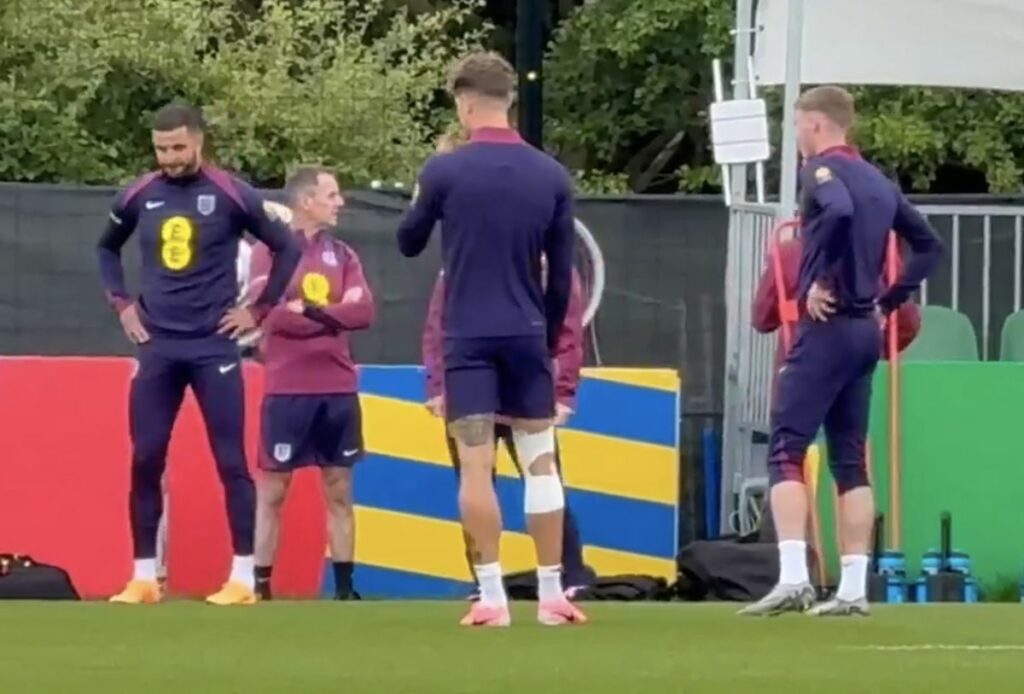 John Stones spotted training in knee strapping